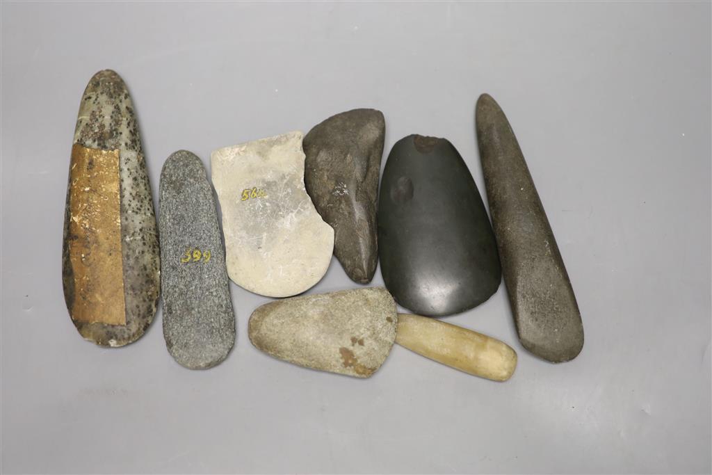 A group of stone adze hand tools, three 19th century Papua New Guinea, each labelled New Guinea, collected before 1950,